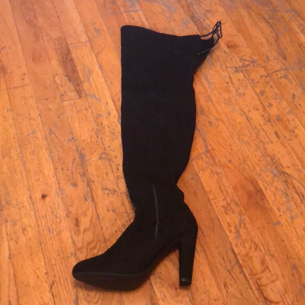 thigh high boots, tie at the back of the shoe on the top, a zipper at the ankle